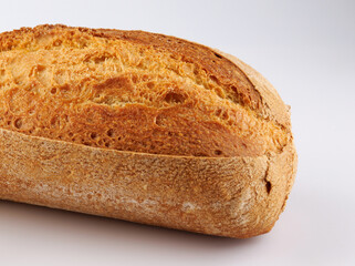 Baguette, part of a loaf on a white background.