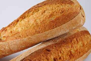 Baguette, two loaves on a white background. Two baguettes on a white background.