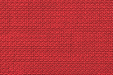 Red knitted fabric with a textured pattern, suitable for upholstery or clothing.
