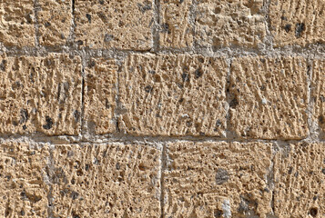 background of the volcanic stone called tuff used by the ancient Italian peoples for the construction of buildings