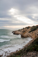 Majestic View: Mountains, Stones, Plants, Sea, and Sky Along the Coast of Vilanova and Sitges