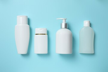 Natural cosmetic products on a blue background, top view