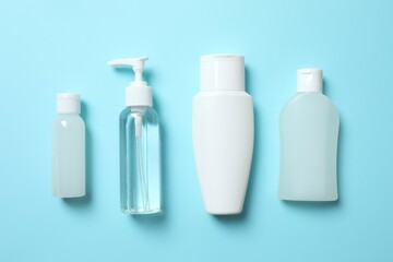 Natural cosmetic products on a blue background, top view