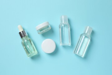 Natural cosmetic products on a blue background, top view