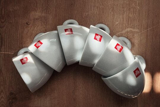 Illy coffee cups on table