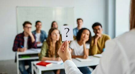 Students engaged in a classroom discussion while teacher presents a question to the class during an interactive learning session