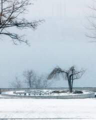 Winter Park. Walking around the city during heavy snowfall. Winter landscape in Ukraine. White snow...