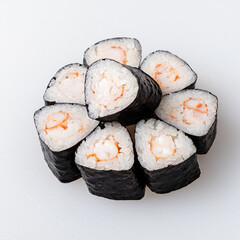 Delightful Arrangement of Hand-Rolled Sushi Featuring Shrimp Nestled in Fluffy Rice Wrapped in Seaweed on a Clean Surface