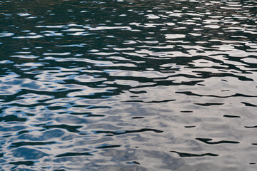 The abstract close-up shot captures the mesmerizing patterns of light and shadow playing across the...