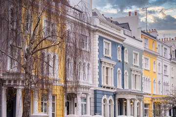 Elegant Colorful Townhouses in Notting Hill, London: Iconic British Architecture with Pastel Facades, Arched Windows, and Classic Details on a Charming Street