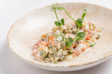 Delightful Summer Salad Featuring Fresh Vegetables, Tender Chicken, and Zesty Dressing Served on a Rustic Plate at a Charming Outdoor Cafe During a Sunny Afternoon