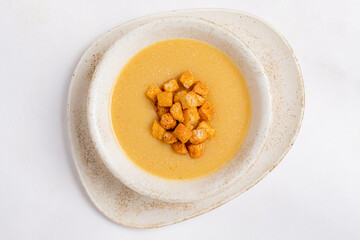 Creamy Soup Garnished With Croutons Served in a Rustic Bowl, Inviting Warmth and Comfort on a Chilly Evening