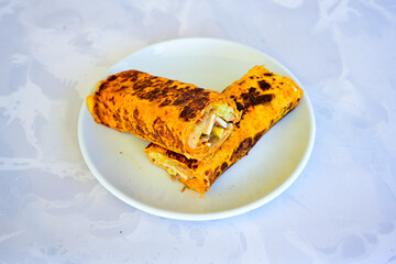 Lavash doner kebab ( zurna doner durum )  or shawarma sliced in plate isolated.  Tavuk Et Doner Durum. Hatay usulu tavuk doner durum. 