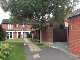 red brick house with garage