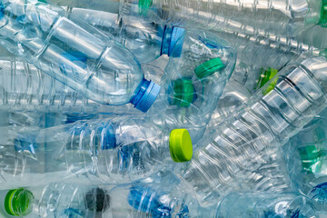 A pile of discarded plastic water bottles, highlighting the issue of plastic pollution.