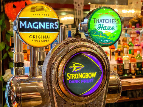 Barnstable, England, UK - 25 October 2019: Close up of bar pumps for cider in a pub in Barnstable town centre.