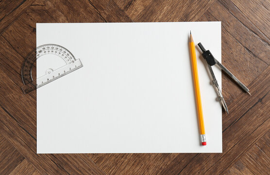 Ruler, paper, compass and pencil on wooden table, flat lay. Space for text