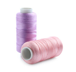 Spools of bright sewing threads isolated on white