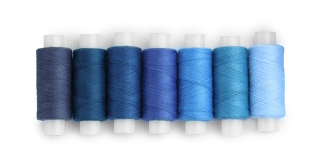 Spools of bright sewing threads isolated on white, top view