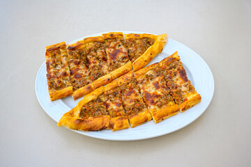Kiymali pide.Turkish pide with minced meat. Turkish pizza mince pita Pide on white . Etli ekmek.Kusbasi kasarli, kiymali kasarli, kiymali yumurtali, Bafra, Trabzon, Kusbasili pide. Urfa acili lahmacun