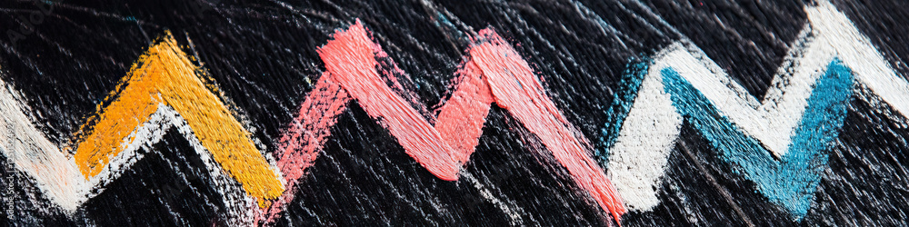 Poster painted zig-zag patterns on dark surface