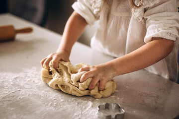 girl hands kneading dough