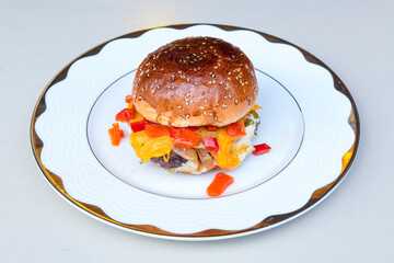 Big tasty burger with beef cutlet on a plate. Hamburger, cheeseburger with mushroom. Hamburger, Mexica, mushroom double burger.  Crispy chicken burger. With french fries, patates kizartmasi.