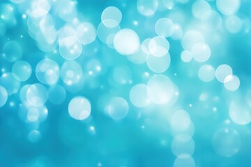 Soft turquoise bokeh background with blurred light circles