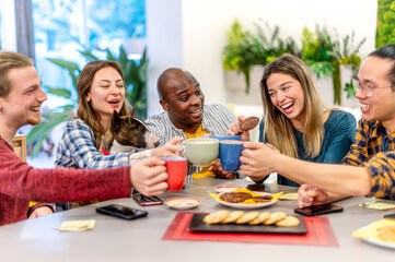 Happy friends with dog having breakfast together at cafe bar - Group of diverse young people...