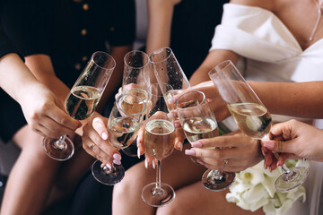 hands with champagne glasses