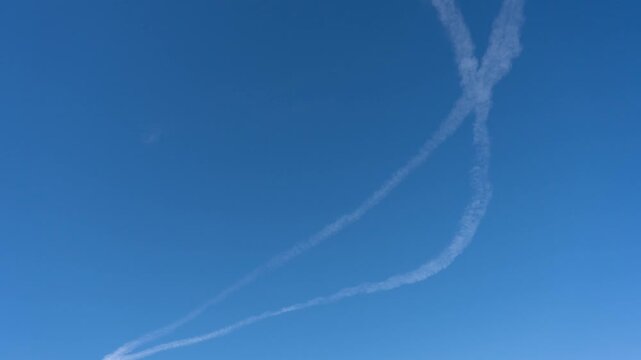 Time lapse of jet contrails cloud seeding or wether modification
