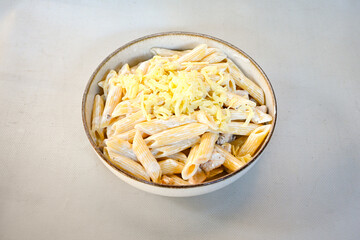 Macaroni Salad with red bell pepper, onion, celery, gherkins and mayonnaise dressing.Traditional Italian pasta with vegetables and creamy cottage cheese in a bowl. Fettuccini, alfredo makarna.