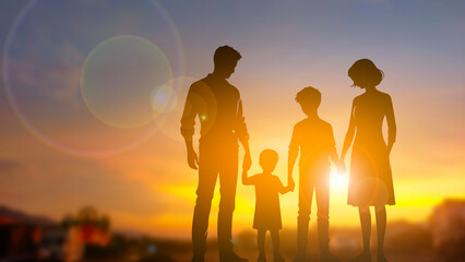 Silhouette family on sunset time blur background