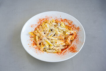 Macaroni Salad with red bell pepper, onion, celery, gherkins and mayonnaise dressing.Traditional Italian pasta with vegetables and creamy cottage cheese in a bowl. Fettuccini, alfredo makarna.