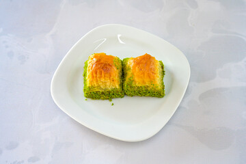 Turkish Dessert Sobiyet, havuc dilimi, midye baklava, mussels baklava and classic baklava with Pistachio . Cikoltali cevizli, fistikli soguk Baklava, top view.