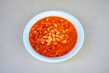 Turkish Etli Kuru Fasulye food with Traditional Turkish table with decoration. Nohut yemegi. Pilav ustu, kuru fasulye, nohut. Gunun menusu.
