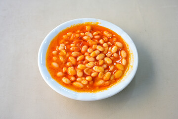 Turkish Etli Kuru Fasulye food with Traditional Turkish table with decoration. Nohut yemegi. Pilav ustu, kuru fasulye, nohut. Gunun menusu.