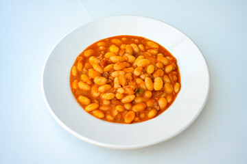 Turkish Etli Kuru Fasulye food with Traditional Turkish table with decoration. Nohut yemegi. Pilav ustu, kuru fasulye, nohut. Gunun menusu.