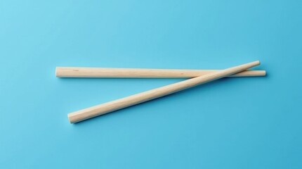 Parallel Disposable Wooden Chopsticks on Blue Background