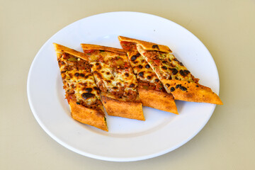 Kiymali pide.Turkish pide with minced meat. Turkish pizza mince pita Pide on white . Etli ekmek.Kusbasi kasarli, kiymali kasarli, kiymali yumurtali, Bafra, Trabzon, Kusbasili pide. Urfa acili lahmacun