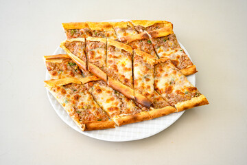 Kiymali pide.Turkish pide with minced meat. Turkish pizza mince pita Pide on white . Etli ekmek.Kusbasi kasarli, kiymali kasarli, kiymali yumurtali, Bafra, Trabzon, Kusbasili pide. Urfa acili lahmacun