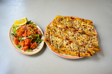 Kiymali pide.Turkish pide with minced meat. Turkish pizza mince pita Pide on white . Etli ekmek.Kusbasi kasarli, kiymali kasarli, kiymali yumurtali, Bafra, Trabzon, Kusbasili pide. Urfa acili lahmacun