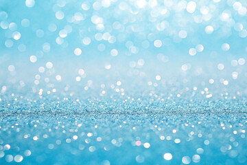 Light blue glitter background with bokeh.  Possible use  Christmas, party, celebration