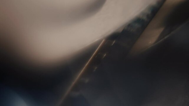 Close ups of a vintage 8MM projector spools moving and playing film 