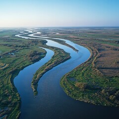Fototapeta premium Aerial view meandering river, flatlands, sunrise, nature, travel brochure