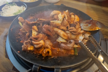Spicy stir-fried Octopus Pork Belly on pan, Korean food