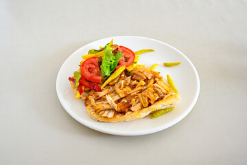 Lavash zurna doner kebab ( zurna  durum )  or shawarma sliced in plate isolated.  hatay usulu tavuk Et doner durum. Gobit ekmek arasi doner. Pilavustu iskender doner kebap. 