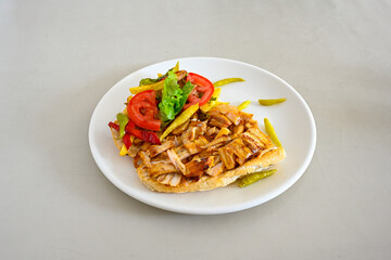 Lavash zurna doner kebab ( zurna  durum )  or shawarma sliced in plate isolated.  hatay usulu tavuk Et doner durum. Gobit ekmek arasi doner. Pilavustu iskender doner kebap. 