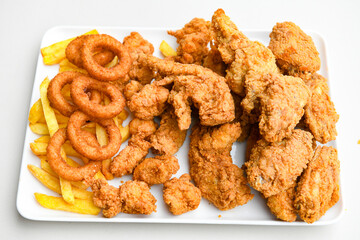 Homemade fried chicken nuggets isolated on white background. Chicken nugget. Citir tavuk. Citir, tavuk atistirma  tabagi.