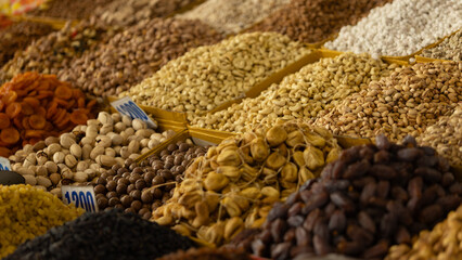 a basket of dried nut, fruit and almond in Osh Bazaar at Bishkek, Kyrgyzstan. 